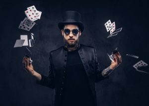magician-showing-trick-with-playing-cards