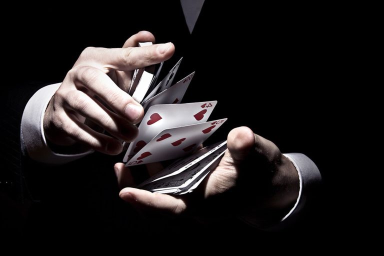 magician-shuffling-the-cards-in-a-cool-way-under